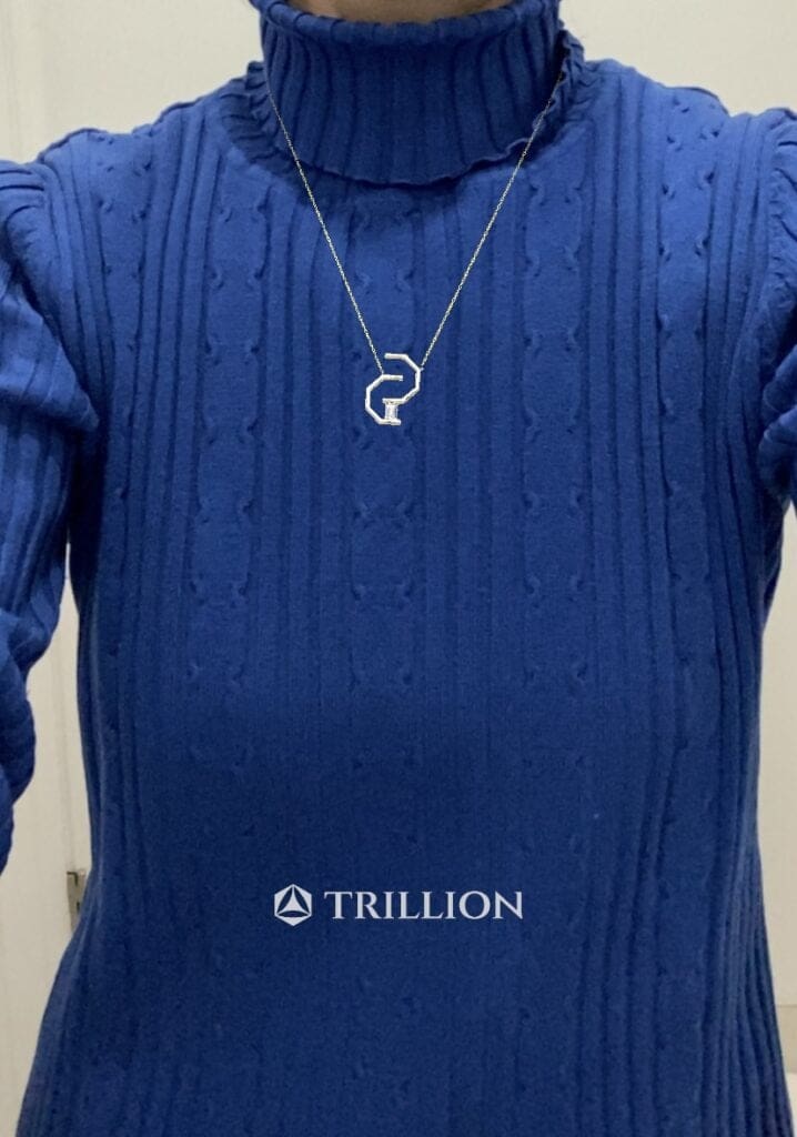 Screenshot of a woman wearing an augmented reality necklace from Trillion Jewelry App.