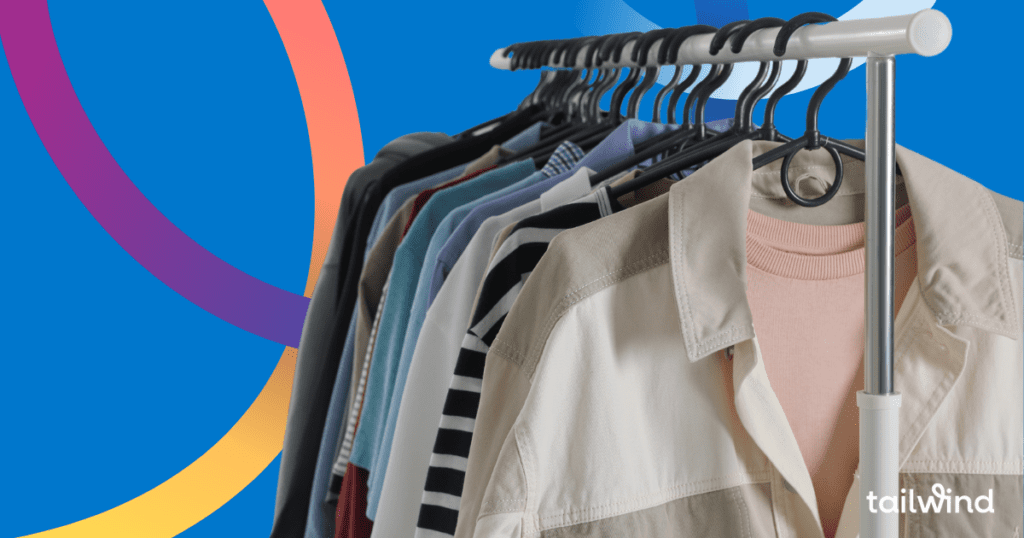 Photo of a set of shirts hanging on a clothes rack on a blue background with the word Tailwind in white font.